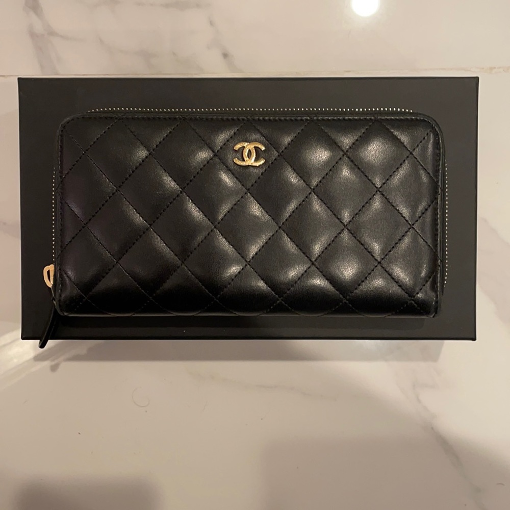 CHANEL
Lambskin Quilted Large Gusset Zip Around Wallet Black with gold hardware